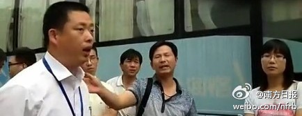 Government official outside complaint bureau, Suzhou, Jiangsu province, July 2013, screenshot.