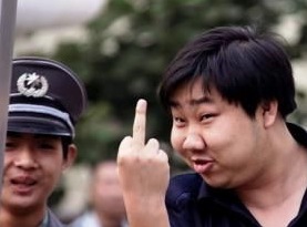 Unidentified police guard outside Liu Xia's apartment, Beijing, screenshot, 5-25-12.