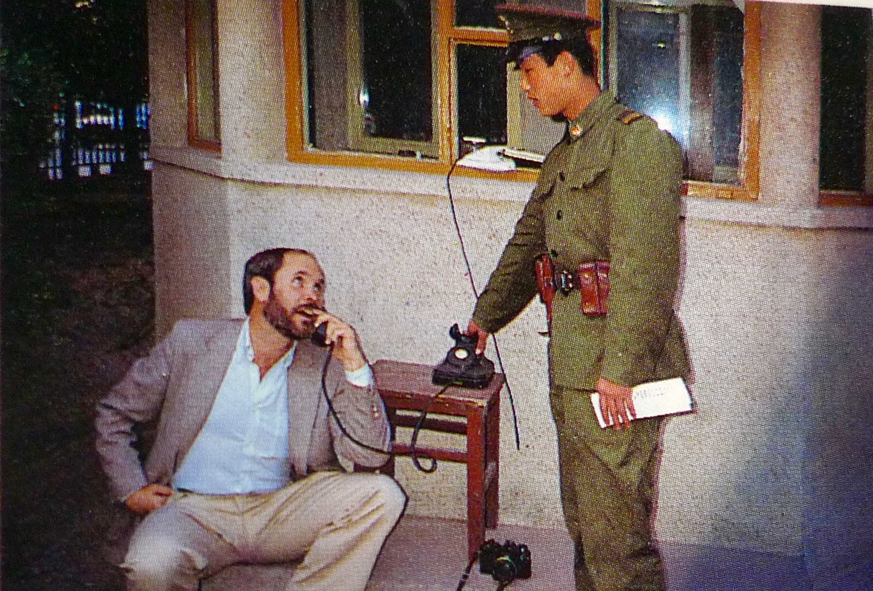 "Help me, information, more than that I cannot add." Steve McCurry and unidentified PLA guard, 1989, A Day in the Life of China. [Photo: Doug Menuez]