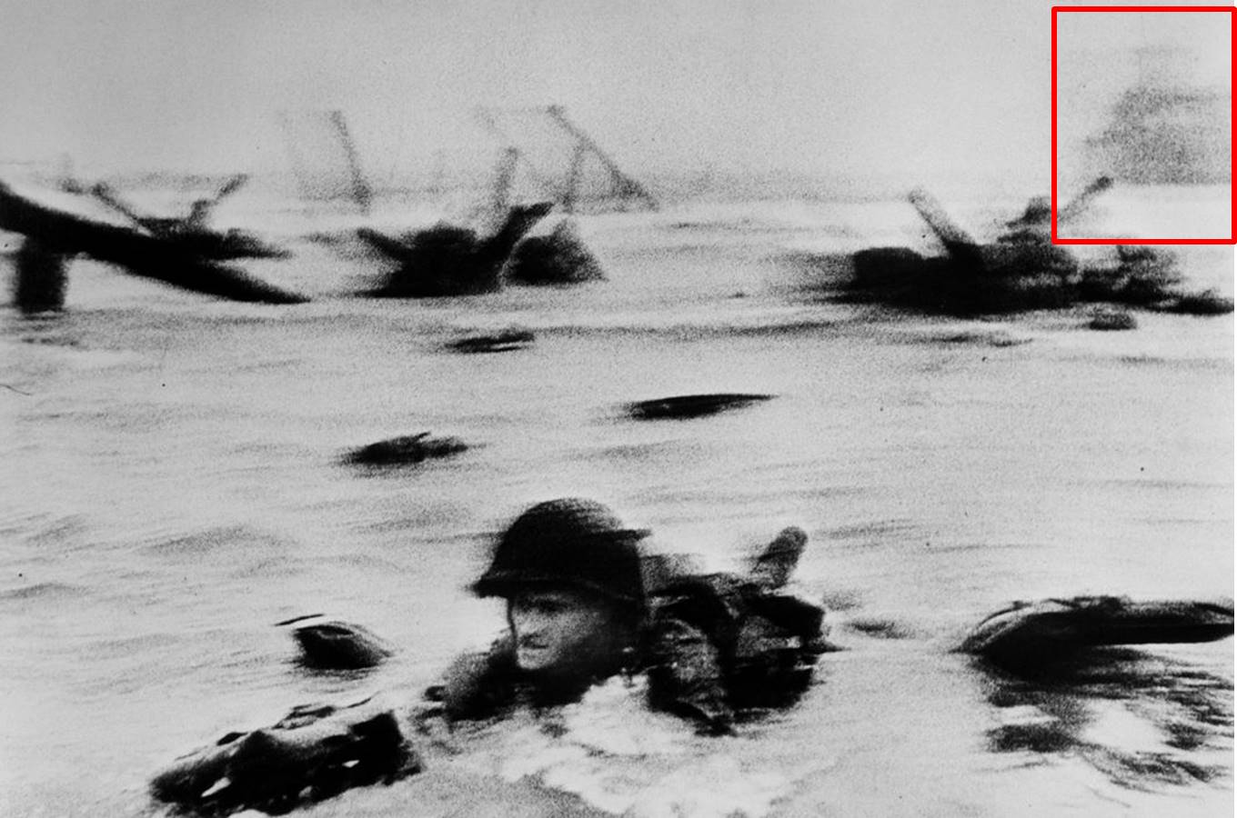 16 - Robert Capa, photo C37, The Face in the Surf, annotated by Charles Herrick. The silhouette of the LCI(L)-94, aboard which Capa joined the USS Samuel Chase after Omaha Beach, appears in the red rectangle at upper right. Source: Guest Post 28: Charles Herrick on Capa's D-Day (j), June 6, 2019.