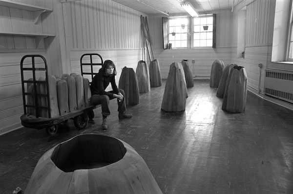 Ursula von Rydingsvard in her studio, photo by Blaise Tobia (1978)