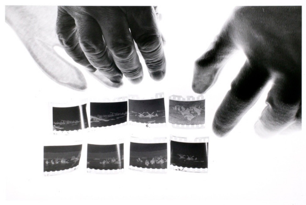 John Loengard, Cornell Capa's hands with Robert Capa D-Day negatives (1993), screenshot